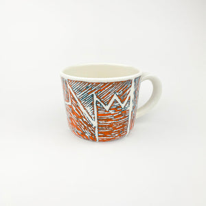 ORANGE AND TEAL PORCELAIN CUP