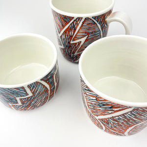 ORANGE AND TEAL PORCELAIN CUP