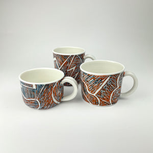 ORANGE AND TEAL PORCELAIN CUP